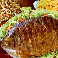 imagem Completo de peixe na brasa
