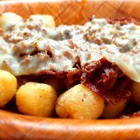 imagem Porção Aipim Especial com Carne seca ou Costela desfiadas e Mussarela gratinada